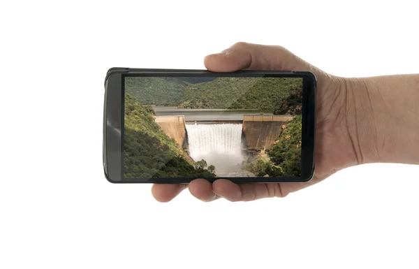 Vrouwelijke hand met mobiele telefoon waterval — Stockfoto