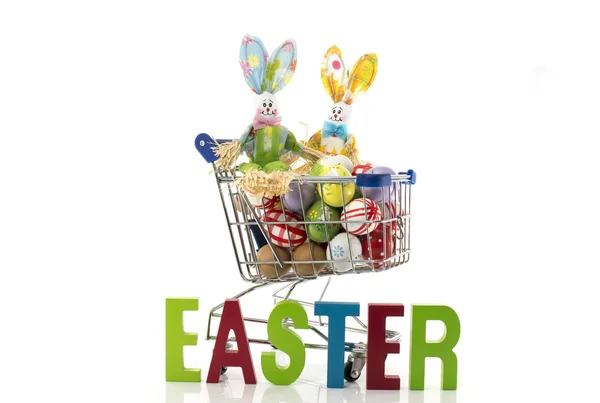 Shopping cart with easter eggs and bunny  isolated on white — Stock Photo, Image