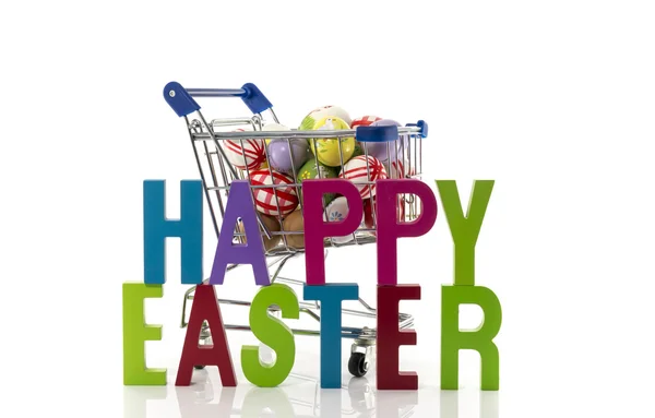 Nákupní vozík s velikonoční vajíčka — Stock fotografie