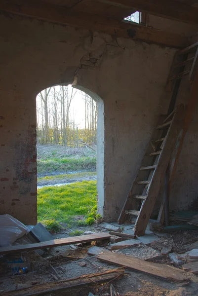 Old abandoned house with wooden ladder — Stock Photo, Image