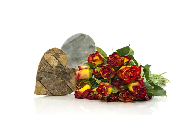 Old red and yellow roses and heart shape — Stock Photo, Image