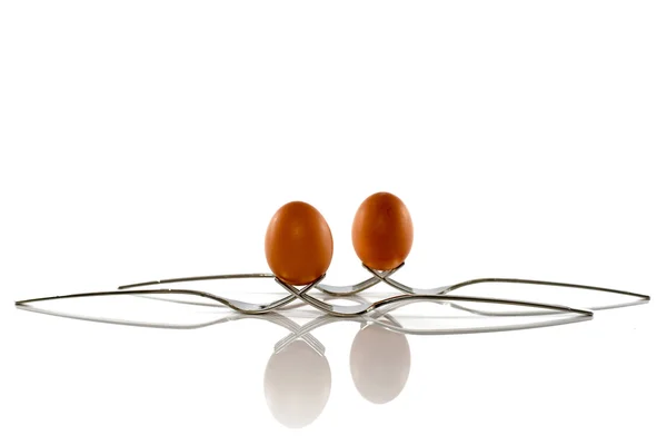 Two eggs on four forks — Stock Photo, Image