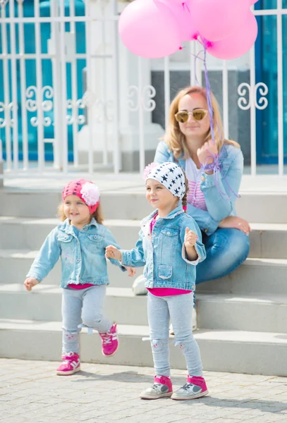 Happy young family on the street of european city. — Stock Photo, Image