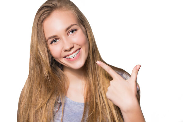 Portrait of teen girl showing dental braces.