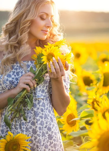Portrait of the beautiful girl with a sunflowers — Stock Photo, Image