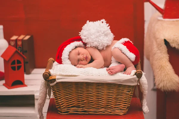 Portrait of sleeping newborn baby boy in Santa clothes. — Stock Photo, Image