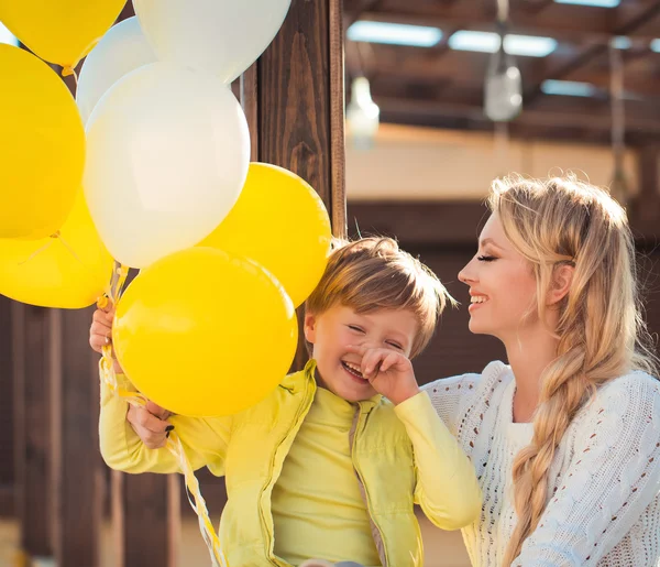 Mother with son at the autumn street — Stock Photo, Image