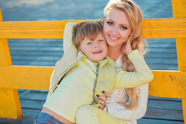 Mother with son at the autumn street — Stock Photo, Image