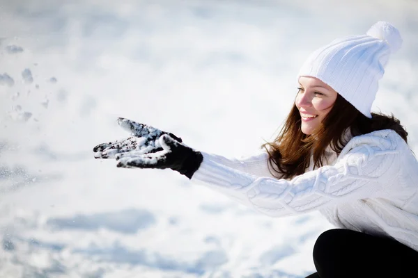 Girl playing with snow — Stock Photo, Image