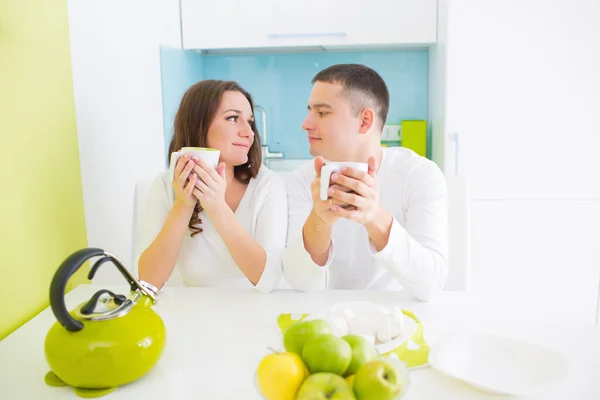 Young beautiful couple on kitchen — Stock Photo, Image