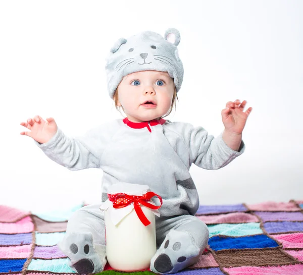 Child with bank of milk — Stock Photo, Image