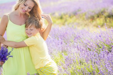 Mother with little son on lavender field