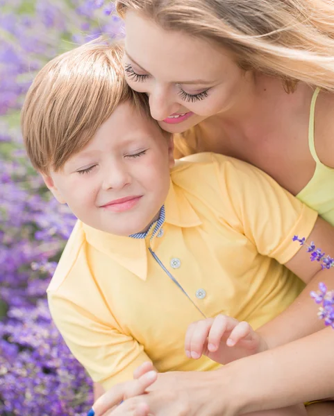 Mother with little son on lavender field — 스톡 사진