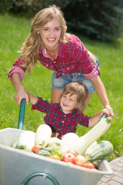 Happy family in the garden — Stock Photo, Image