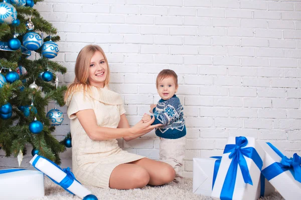 Mother with son near christmas tree — Stock Photo, Image