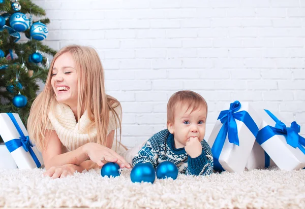 Mother with son near christmas tree — Stock Photo, Image