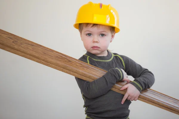 Boy with plinth in his hands — Stock Photo, Image