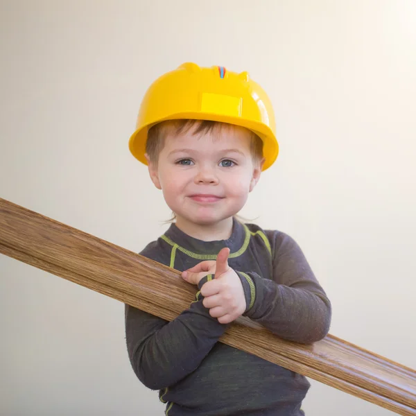 Boy with plinth in his hands — Stock Photo, Image