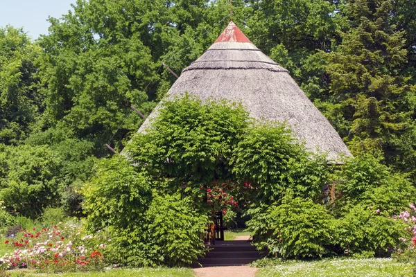Thatched cottage in a park