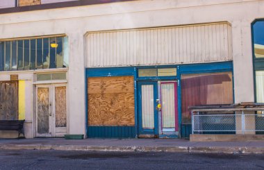 Old Abandoned Store Front Buildings In Depressed Area clipart