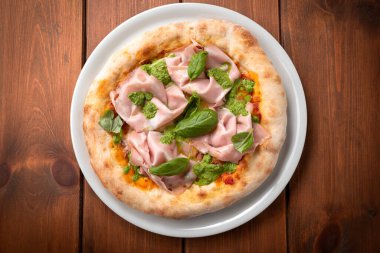 Delicious gourmet pizza with mortadella and pesto sauce, Italian cuisine  clipart