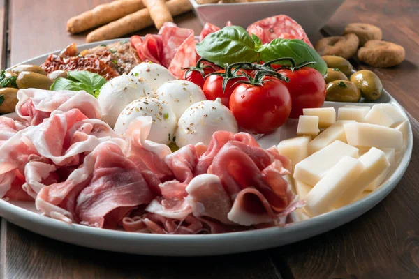 Platter Delicious Italian Antipasti Prosciutto Crudo Mozzarella Salami Tomato Basil — Stock Photo, Image