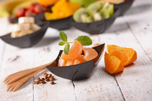 Assorted fruit in bowls — Stock Photo, Image