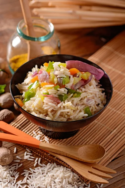 Basmati rice in black bowl — Stock Photo, Image