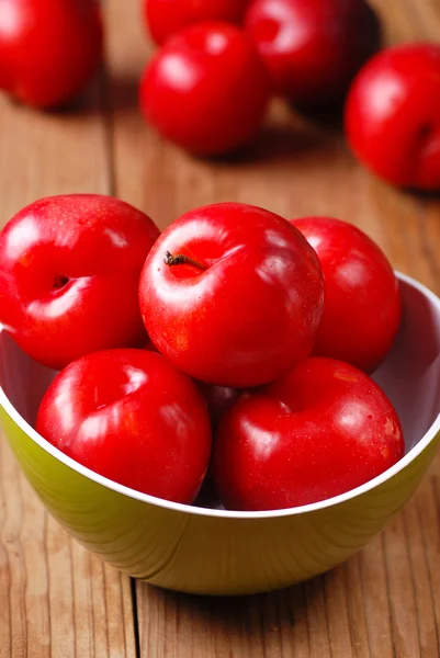 Red plums in bowl — Stock Photo, Image