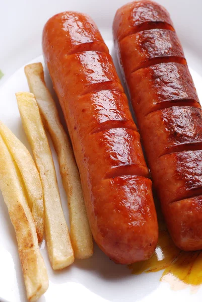 Sausage with french fries — Stock Photo, Image