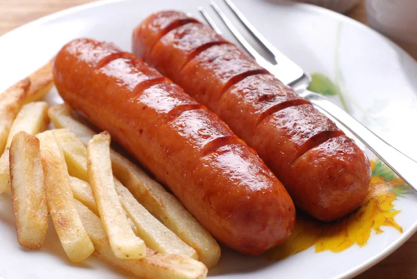 Sausage with french fries — Stock Photo, Image