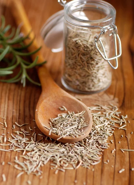 Dried rosemary on the spoon — Stock Photo, Image