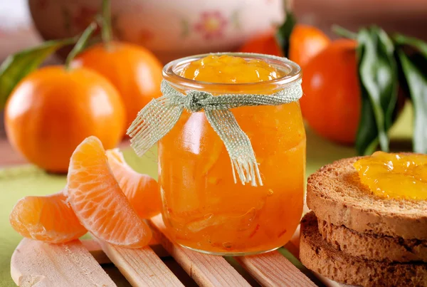 Tangerine jam in glass jar — Stock Photo, Image