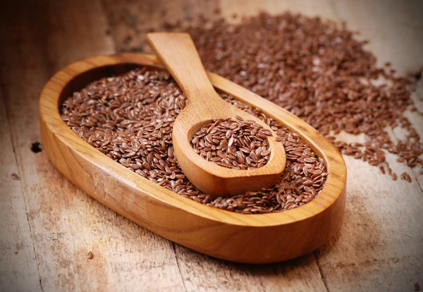 Flax seeds in spoon — Stock Photo, Image