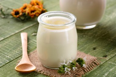 white yogurt in glass jar clipart