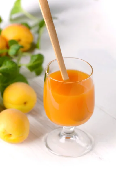 Apricot juice in the glass — Stock Photo, Image