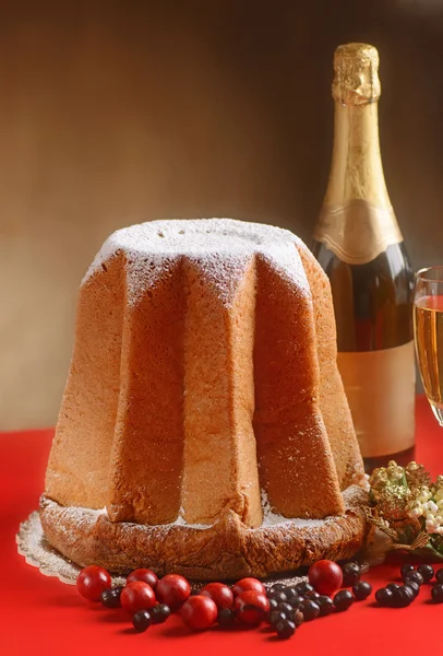 Pandoro on red table — Stock Photo, Image