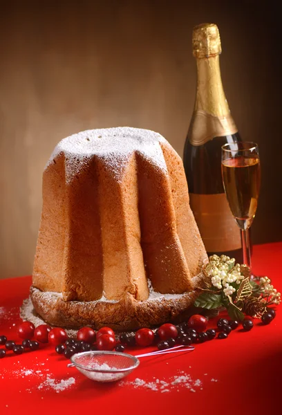 Pandoro on red table — Stock Photo, Image