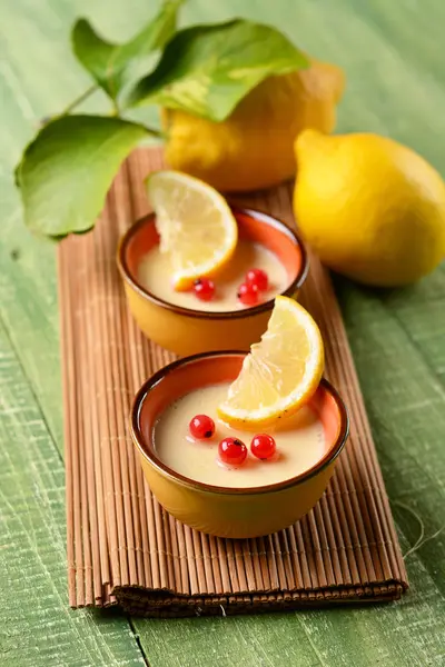 Lemon dessert decorated with currants — Stock Photo, Image