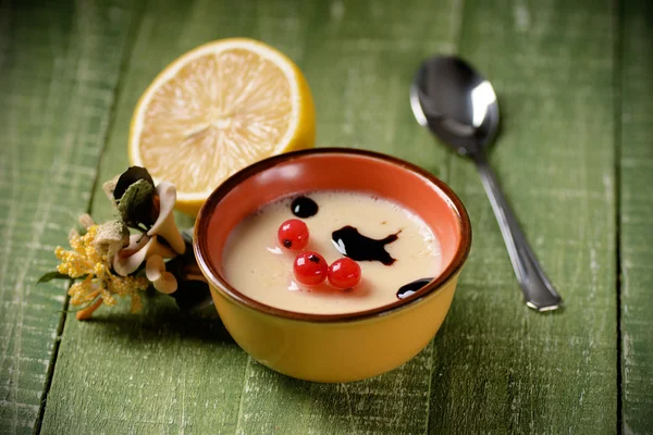 Lemon dessert decorated with currants — Stock Photo, Image