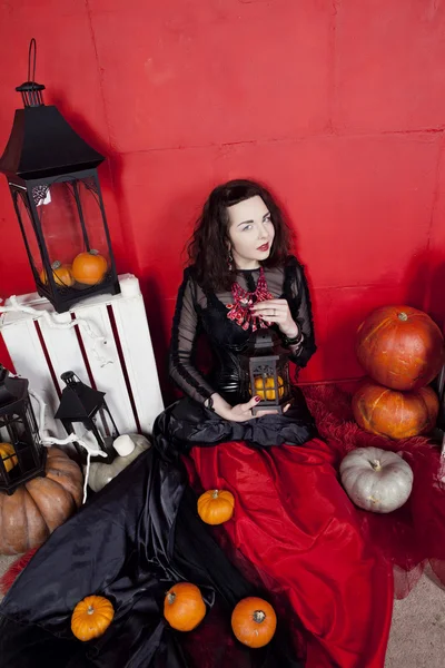 Young woman in photo studio on Halloween — Stock Photo, Image