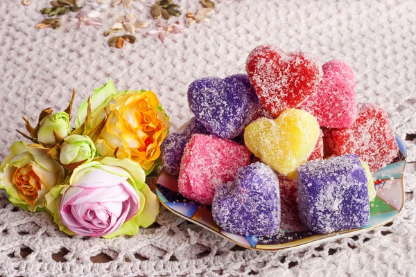 Colored soap in the form of heart on a white crocheted tablecloth — Stock Photo, Image