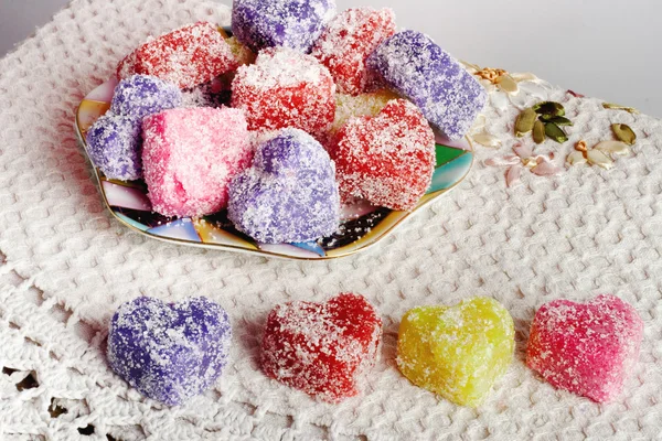 Colored soap in the form of heart on a white crocheted tablecloth — Stock Photo, Image