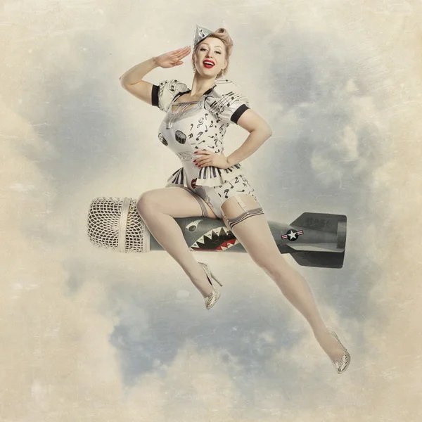 Beautiful young blond woman pin-up in the studio on a white background in the image of pilot for the imitation of a poster — Stock Photo, Image