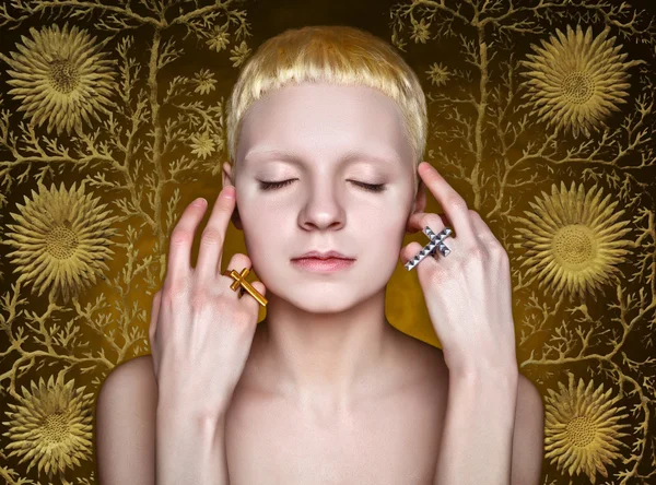 Young androgynous girl with white hair in the studio on yellow  textured background — Stock Photo, Image