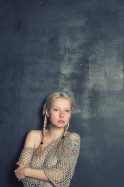 Young beautiful blonde girl with braids