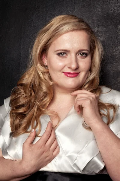 Young beautiful full-bodied blonde woman in a black and white vintage dress — Stock Image Young beautiful full-bodied blonde woman in a black and white vintage dress Stock Picture