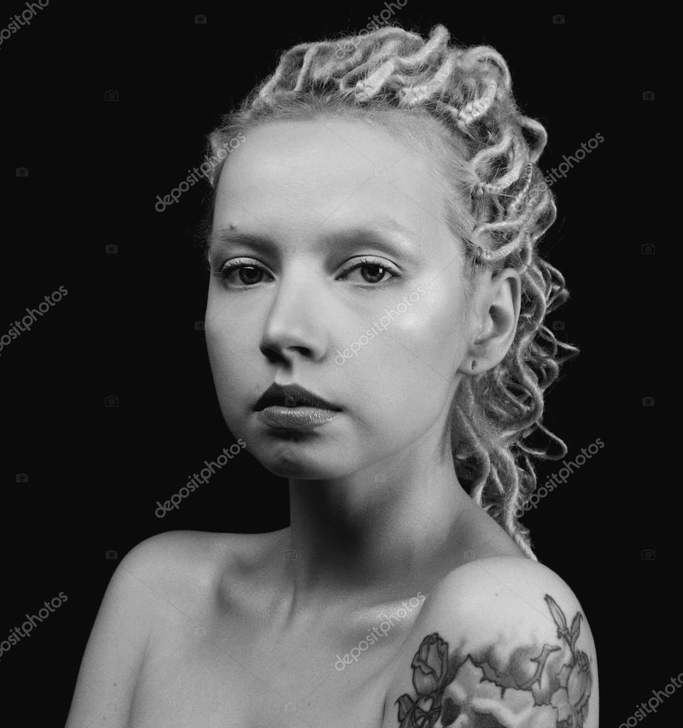 Beautiful Young Blonde Woman With Thin Curly Dreadlocks And
