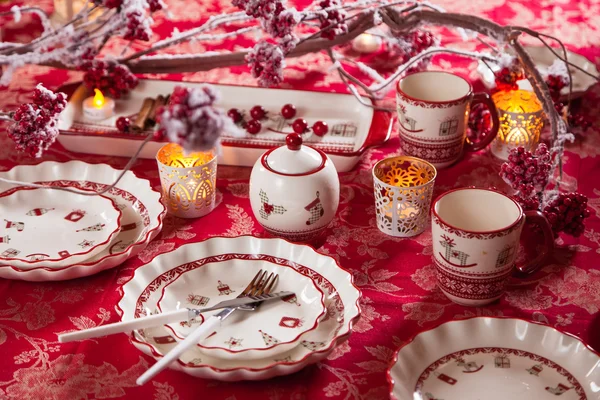 Christmas dishes, cutlery and decor in red and white — Stock Photo, Image