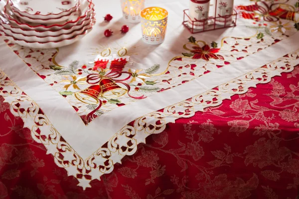 Christmas dishes, cutlery and decor in red and white — Stock Photo, Image